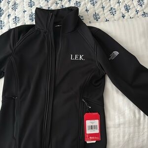 Company branded North Face jacket
